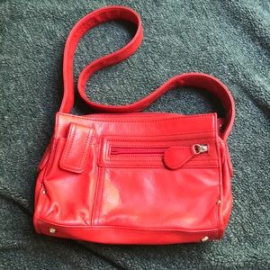 Red leather Perlina purse.